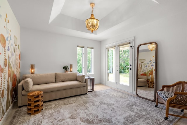 610 Sunset Ct, Argyle, TX 76226 - living room with a chandelier, a tray ceiling, and wood finished floors