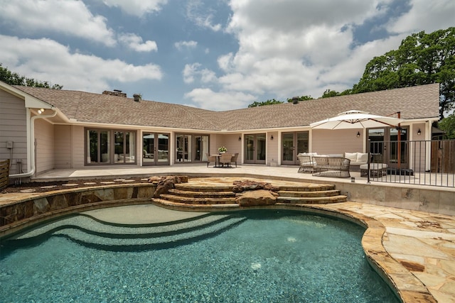 610 Sunset Ct, Argyle, TX 76226 - back of house with french doors, an outdoor pool, a patio, a chimney, and a shingled roof