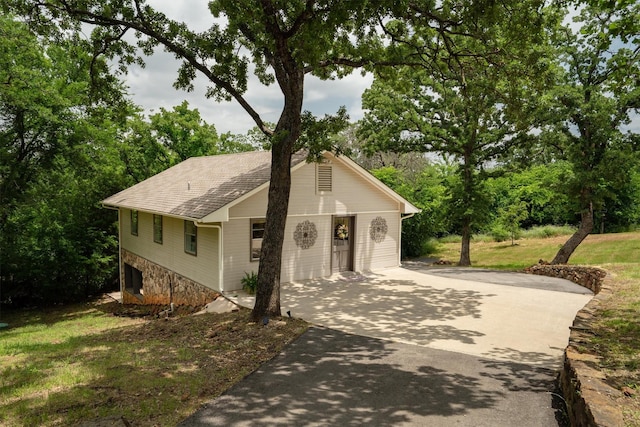 610 Sunset Ct, Argyle, TX 76226 - view of front facade with concrete driveway, a shingled roof, and a front yard