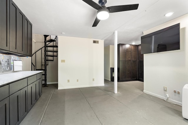 610 Sunset Ct, Argyle, TX 76226 - unfurnished living room featuring baseboards, finished concrete flooring, ceiling fan, stairway, and recessed lighting
