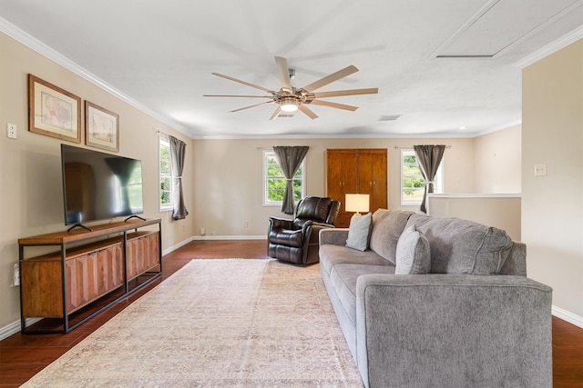 610 Sunset Ct, Argyle, TX 76226 - living room featuring healthy amount of natural light, dark wood-type flooring, ceiling fan, crown molding, and baseboards