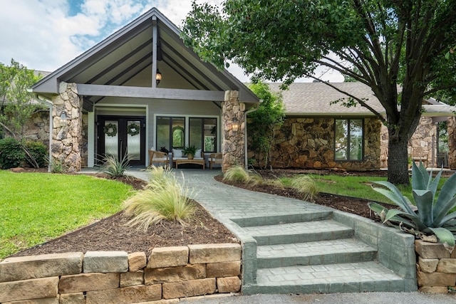 610 Sunset Ct, Argyle, TX 76226 - view of front facade with stone siding, french doors, and a front yard