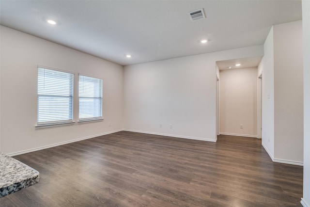 1302 Lowhill Dr, Royse City, TX 75189 - empty room with dark wood finished floors, baseboards, and recessed lighting