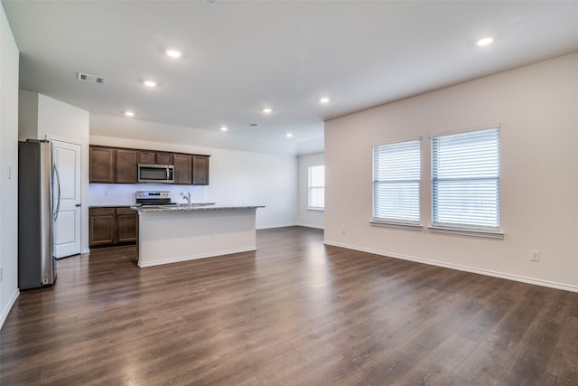 1302 Lowhill Dr, Royse City, TX 75189 - kitchen featuring appliances with stainless steel finishes, dark wood-style floors, open floor plan, recessed lighting, and baseboards