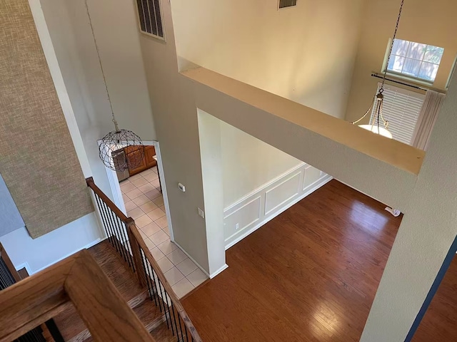 11008 Hermitage Ln, Frisco, TX 75035 - stairs featuring wood finished floors and a towering ceiling