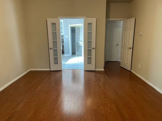 11008 Hermitage Ln, Frisco, TX 75035 - unfurnished room featuring baseboards and dark wood-style flooring