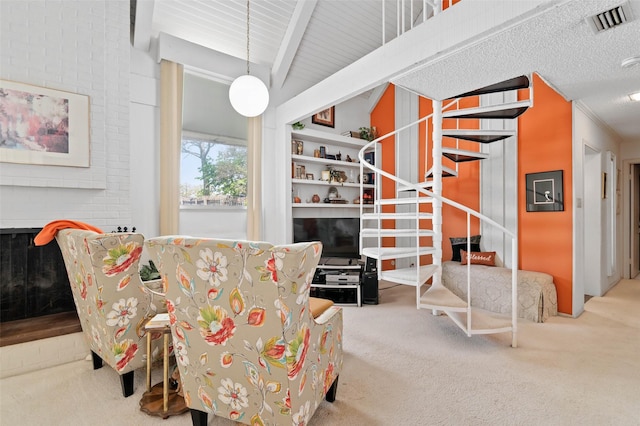 408 Hollyhill Ln, Denton, TX 76205 - living area with carpet floors, stairway, and beam ceiling