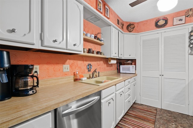 408 Hollyhill Ln, Denton, TX 76205 - kitchen with dishwasher, white microwave, a sink, white cabinetry, and light countertops