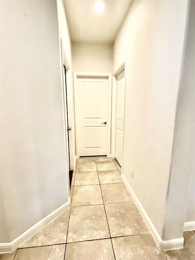 2518 Lavender Ln, Glenn Heights, TX 75154 - hallway with light tile patterned flooring and baseboards
