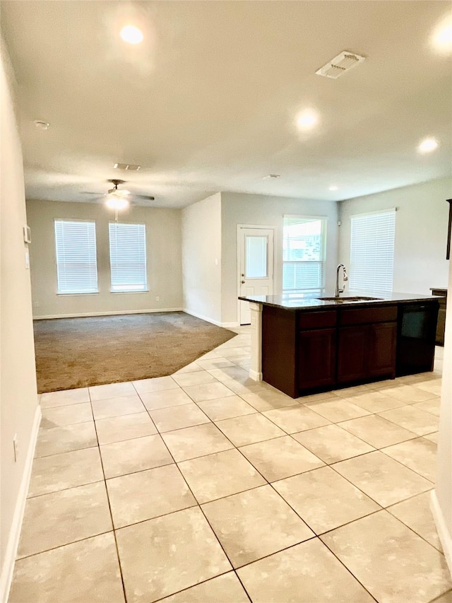 2518 Lavender Ln, Glenn Heights, TX 75154 - kitchen featuring a sink, dishwasher, baseboards, light carpet, and recessed lighting