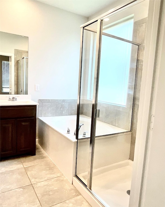 2518 Lavender Ln, Glenn Heights, TX 75154 - full bathroom featuring vanity, a shower stall, a garden tub, and tile patterned flooring