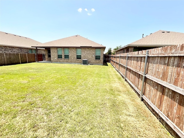 2518 Lavender Ln, Glenn Heights, TX 75154 - rear view of property featuring central AC unit and roof with shingles