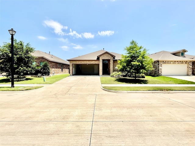 2518 Lavender Ln, Glenn Heights, TX 75154 - view of front of home featuring driveway, an attached garage, a front yard, and brick siding