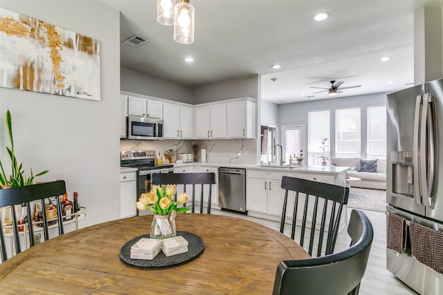 4124 Creekhollow, Carrollton, TX 75010 - dining space with ceiling fan and recessed lighting