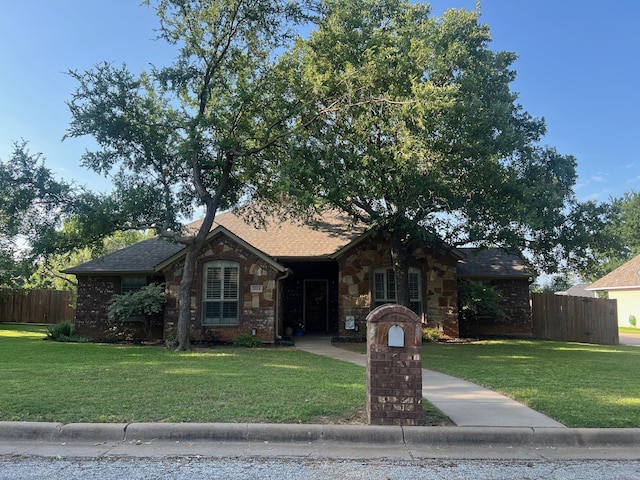 1014 Royal Ln, Graham, TX 76450 - view of front of property featuring stone siding and a shingled roof