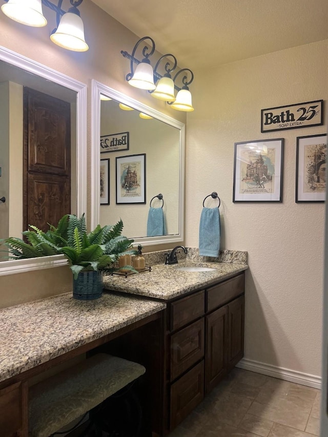 1014 Royal Ln, Graham, TX 76450 - bathroom featuring vanity and baseboards