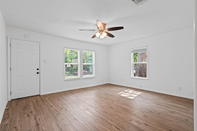 307 Soward Ave, Weatherford, TX 76086 - spare room featuring plenty of natural light, ceiling fan, and wood finished floors