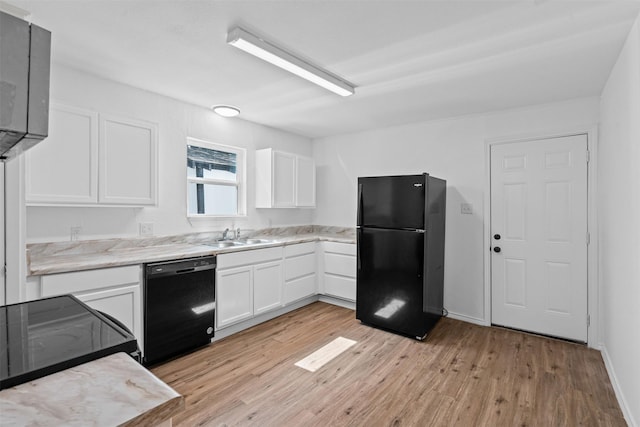 307 Soward Ave, Weatherford, TX 76086 - kitchen featuring black appliances, light wood-style flooring, white cabinetry, and a sink