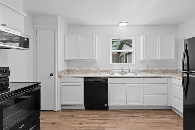 307 Soward Ave, Weatherford, TX 76086 - kitchen with black appliances, a sink, and white cabinets