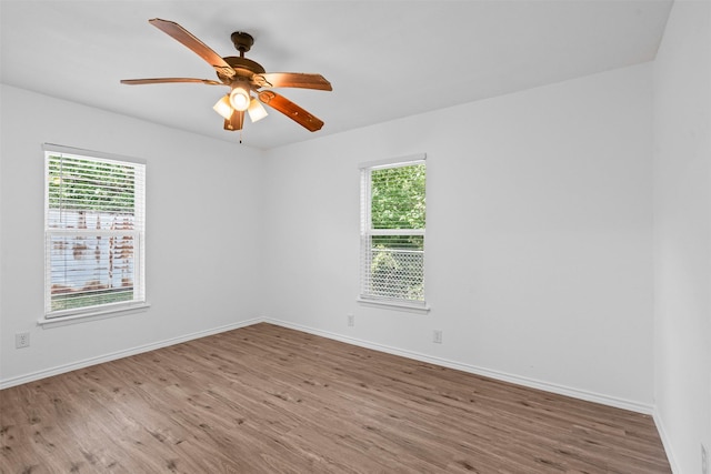 307 Soward Ave, Weatherford, TX 76086 - spare room featuring wood finished floors, baseboards, and a ceiling fan