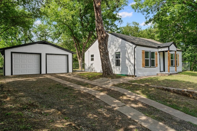 307 Soward Ave, Weatherford, TX 76086 - ranch-style house with an outdoor structure, a detached garage, and a shingled roof