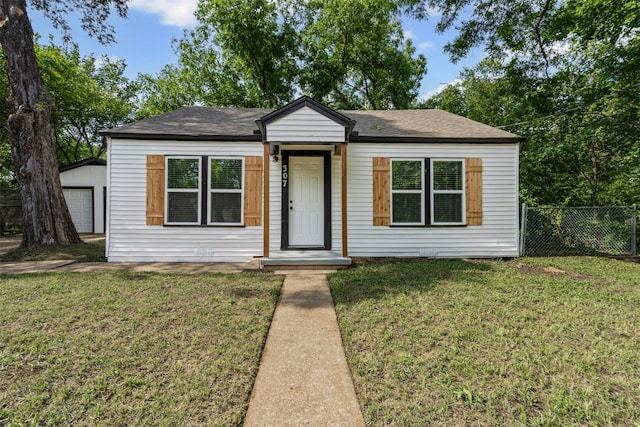 307 Soward Ave, Weatherford, TX 76086 - view of front facade featuring an outbuilding, a shingled roof, and a detached garage