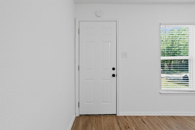 307 Soward Ave, Weatherford, TX 76086 - doorway to outside featuring wood finished floors and baseboards