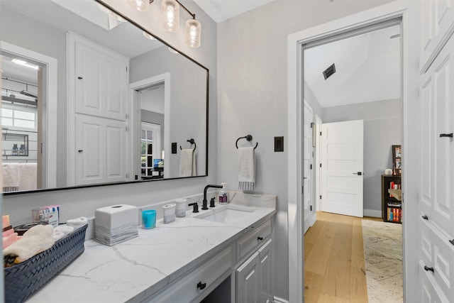 3512 Ridglea Country Club Dr, Fort Worth, TX 76116 - bathroom featuring wood finished floors, vanity, and healthy amount of natural light