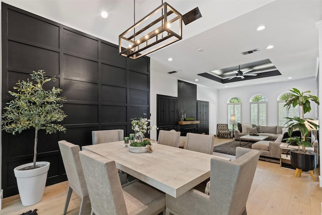 3512 Ridglea Country Club Dr, Fort Worth, TX 76116 - dining space with a decorative wall, light wood-type flooring, ceiling fan, a tray ceiling, and recessed lighting