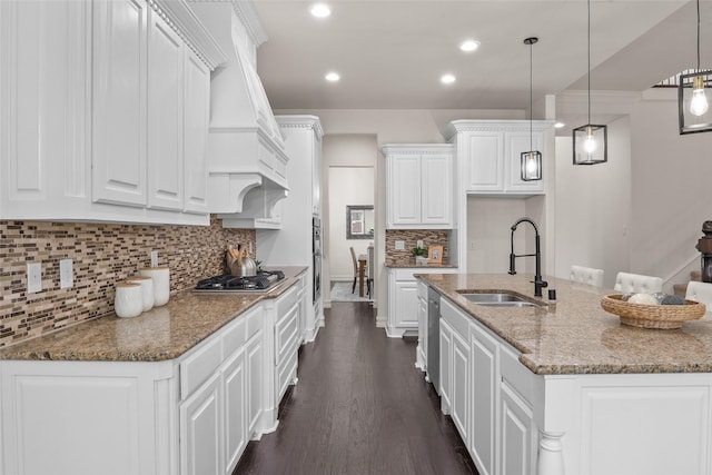 2820 Annandale Dr, Trophy Club, TX 76262 - kitchen featuring a sink, white cabinets, appliances with stainless steel finishes, tasteful backsplash, and dark wood-type flooring
