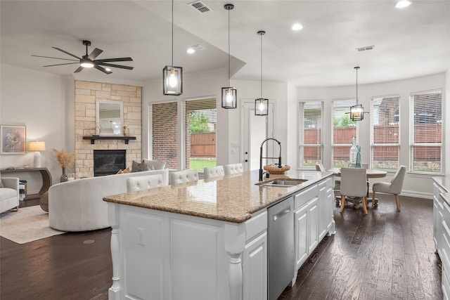 2820 Annandale Dr, Trophy Club, TX 76262 - kitchen featuring a sink, stainless steel dishwasher, a fireplace, ornamental molding, and ceiling fan
