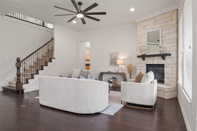 2820 Annandale Dr, Trophy Club, TX 76262 - living area featuring a ceiling fan, crown molding, wood finished floors, a stone fireplace, and stairs