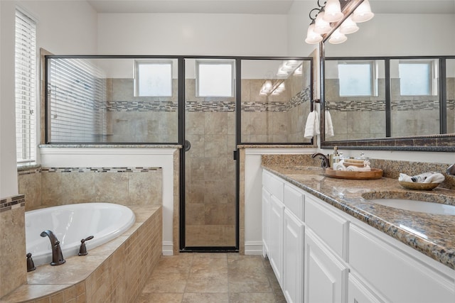 2820 Annandale Dr, Trophy Club, TX 76262 - full bath featuring a garden tub, a stall shower, double vanity, and a chandelier