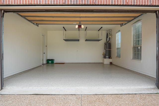 2820 Annandale Dr, Trophy Club, TX 76262 - garage featuring water heater, a garage door opener, and baseboards