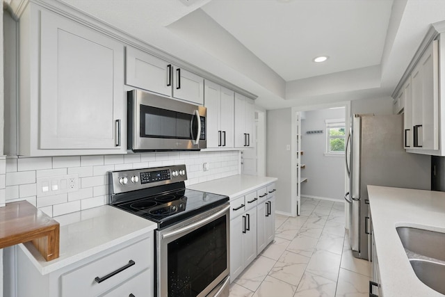 4448 Atlanta Dr, Plano, TX 75093 - kitchen with appliances with stainless steel finishes, light marble finish floors, light countertops, recessed lighting, and tasteful backsplash