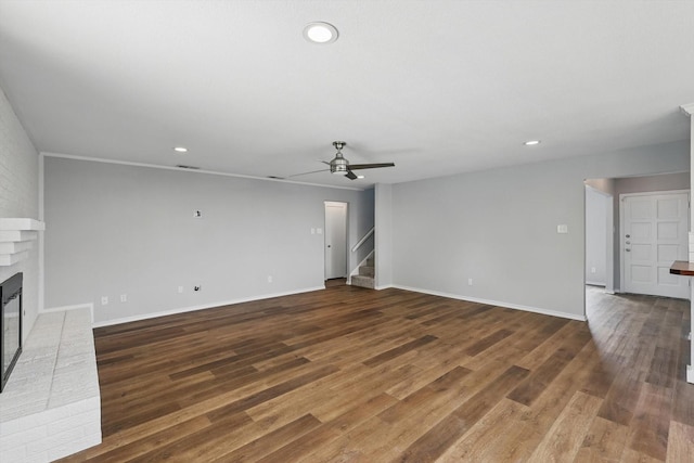 4448 Atlanta Dr, Plano, TX 75093 - unfurnished living room with stairs, a fireplace, ceiling fan, recessed lighting, and wood finished floors