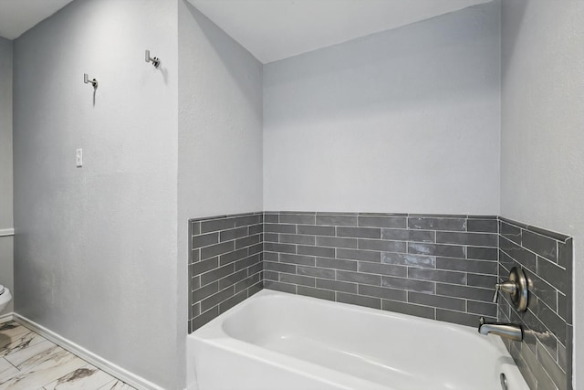 4448 Atlanta Dr, Plano, TX 75093 - full bath featuring a garden tub, toilet, marble finish flooring, and baseboards