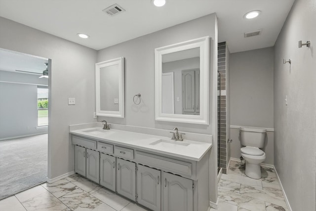 4448 Atlanta Dr, Plano, TX 75093 - bathroom featuring marble look tile flooring, baseboards, double vanity, toilet, and recessed lighting
