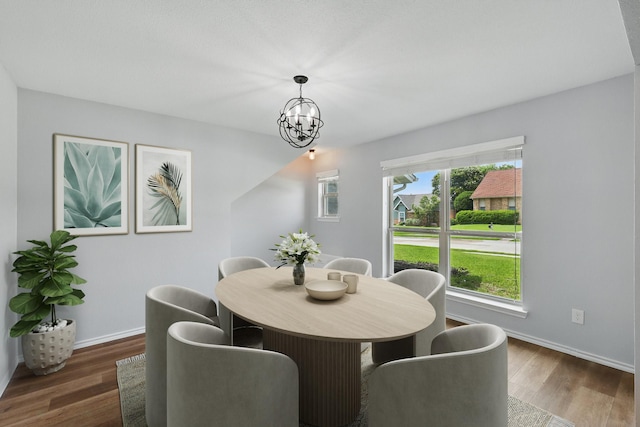 4448 Atlanta Dr, Plano, TX 75093 - dining area with wood finished floors, baseboards, and a chandelier