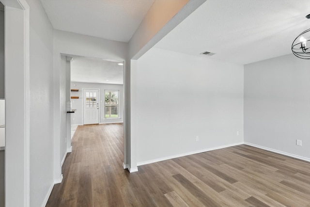 4448 Atlanta Dr, Plano, TX 75093 - hallway with wood finished floors, baseboards, recessed lighting, and a chandelier