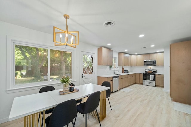 4709 Albermarle Dr, Fort Worth, TX 76132 - dining area with a chandelier, light wood-style flooring, recessed lighting, and baseboards
