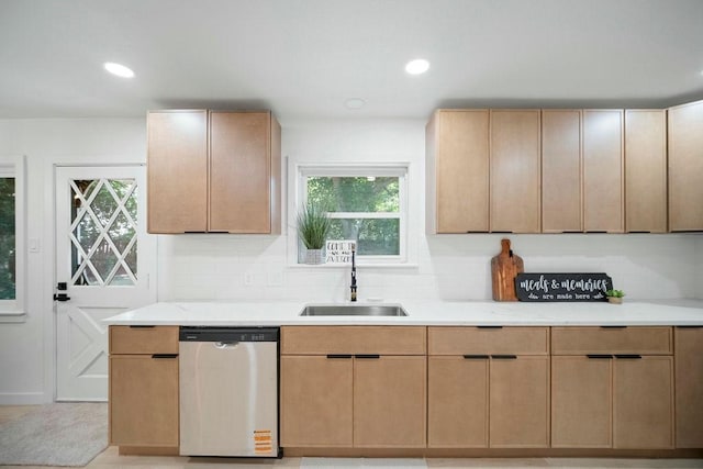 4709 Albermarle Dr, Fort Worth, TX 76132 - kitchen with stainless steel dishwasher, a sink, light countertops, backsplash, and light brown cabinets