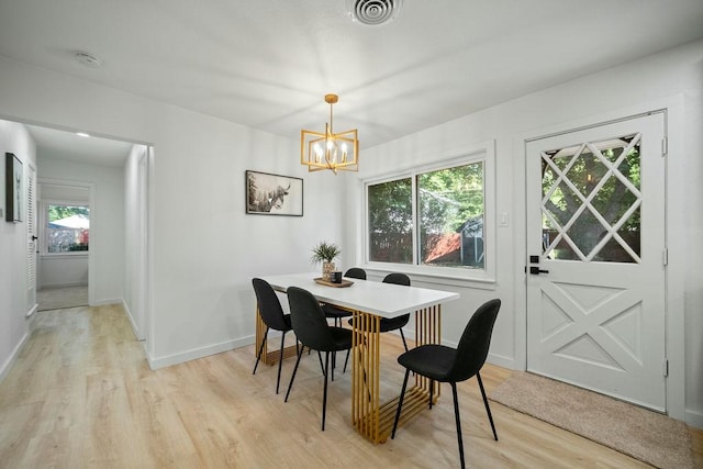 4709 Albermarle Dr, Fort Worth, TX 76132 - dining area with light wood-style flooring, a chandelier, and baseboards