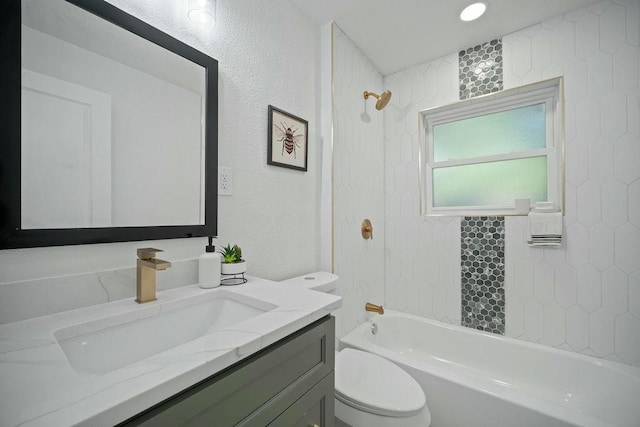 4709 Albermarle Dr, Fort Worth, TX 76132 - bathroom featuring vanity, toilet, tub / shower combination, and a textured wall