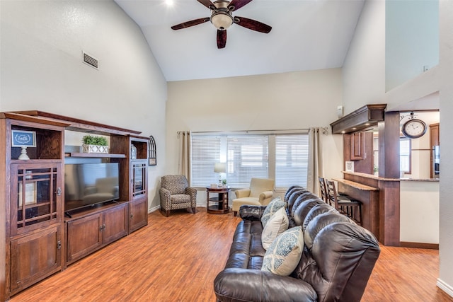 807 Autumn Hill Dr, Wylie, TX 75098 - living room with high vaulted ceiling, ceiling fan, light wood-type flooring, and baseboards