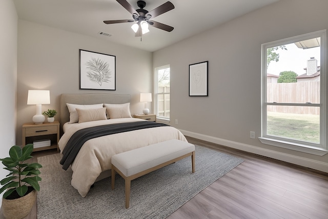 829 Foxridge Dr, Arlington, TX 76017 - bedroom with baseboards, wood finished floors, and ceiling fan