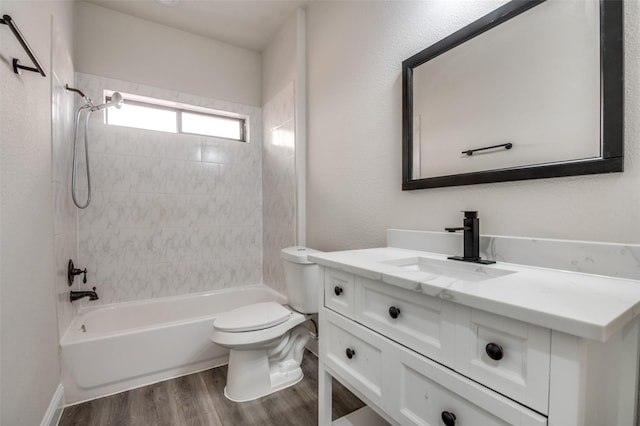 829 Foxridge Dr, Arlington, TX 76017 - bathroom featuring wood finished floors, vanity, toilet, and  shower combination