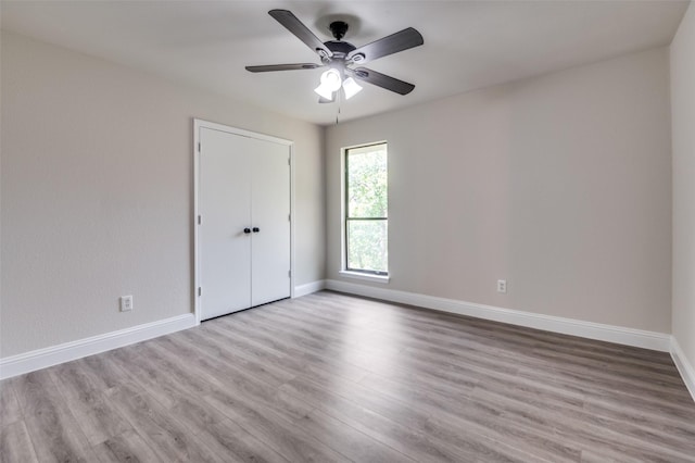 829 Foxridge Dr, Arlington, TX 76017 - spare room featuring baseboards, wood finished floors, and ceiling fan