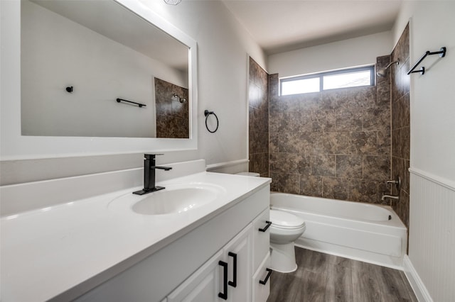 829 Foxridge Dr, Arlington, TX 76017 - bathroom featuring vanity, toilet, shower / bath combination, and wood finished floors