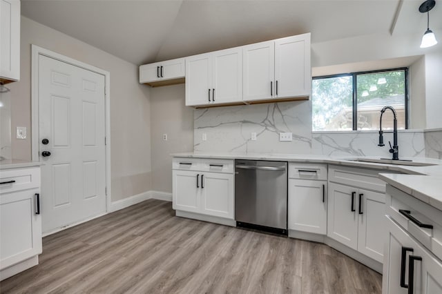 829 Foxridge Dr, Arlington, TX 76017 - kitchen with dishwasher, a sink, lofted ceiling, white cabinets, and tasteful backsplash